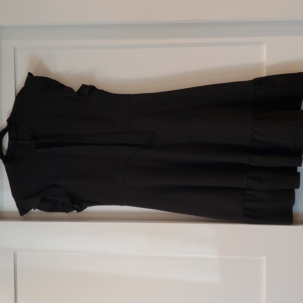 Dress with ruffle sleeves and bottom